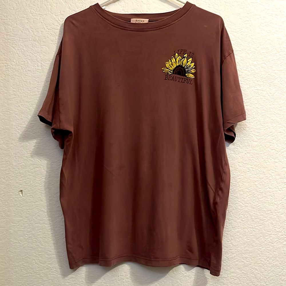 Cute little t-shirt. Worn maybe once or twice. Has one small hole on the side.